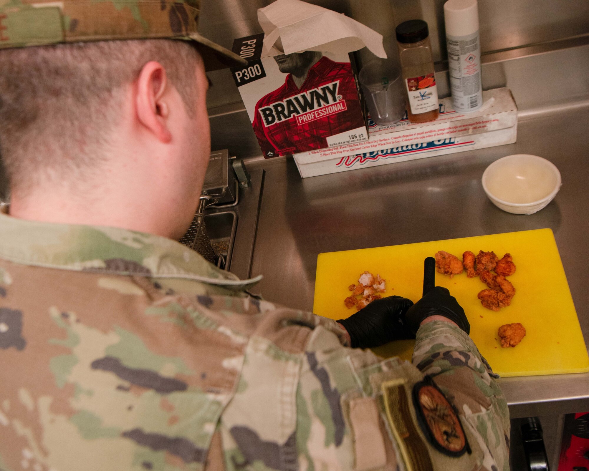 A 5th Force Support Squadron Missile Alert Facility (MAF) chef prepares a meal for Airmen deployed to the MAF near Minot Air Force Base, North Dakota, Feb. 1, 2023. A chef is deployed to each missile site to stay with the crew for the full deployment of at least one week. (U.S. Air Force photo by Senior Airman Micheal Richmond)