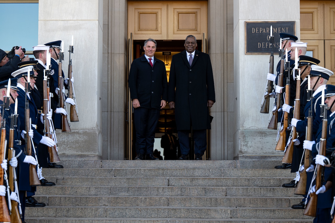 Secretary of Defense Lloyd J. Austin III and Australian Deputy Prime Minister and Minister of Defense Richard Marles pose for a photo on the steps on the Pentagon.