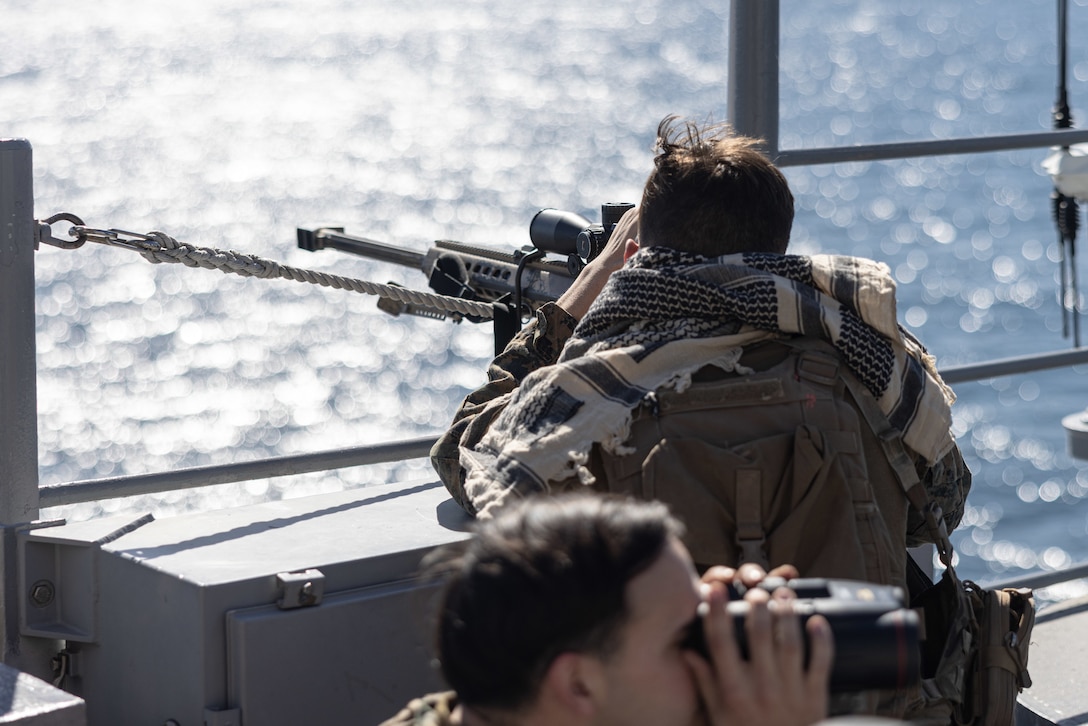 U.S. Marines assigned to Battalion Landing Team 1/6, set security while conducting a defense of the amphibious task force drill (DATF) during Amphibious Squadron/MEU Integrated Training (PMINT), Jan. 28, 2023. The DATF drill positioned Marines and Sailors to augment and reinforce the ships security posture while crossing a simulated strait. (U.S. Marine Corps photo by Cpl. Kyle Jia)