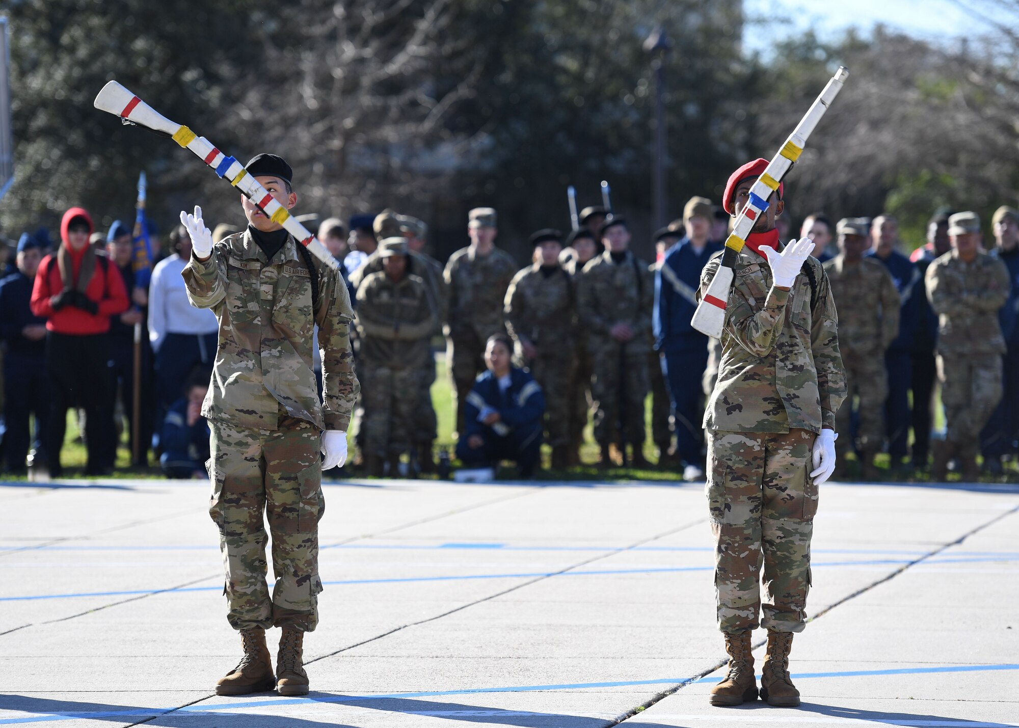 U.S. Air Force Airmen 1st Class Johghun Kim and Christopher French, 335th Training Squadron freestyle drill team members, perform during the 81st Training Group drill down on the Levitow Training Support Facility drill pad at Keesler Air Force Base, Mississippi, Feb. 23, 2023.