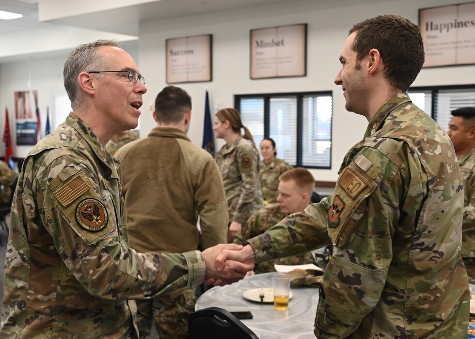 U.S. Air Force Col. Christopher Grussendorf, Air Education and Training Command command surgeon, meets with members of the 17th Medical Group during lunch at the Cressman Dining Facility, Texas, Feb. 3, 2023. Grussendorf opened the floor for discussion of ideas to further improve the 17th MDG. (U.S. Air Force photo by Airman 1st Class Zachary Heimbuch)