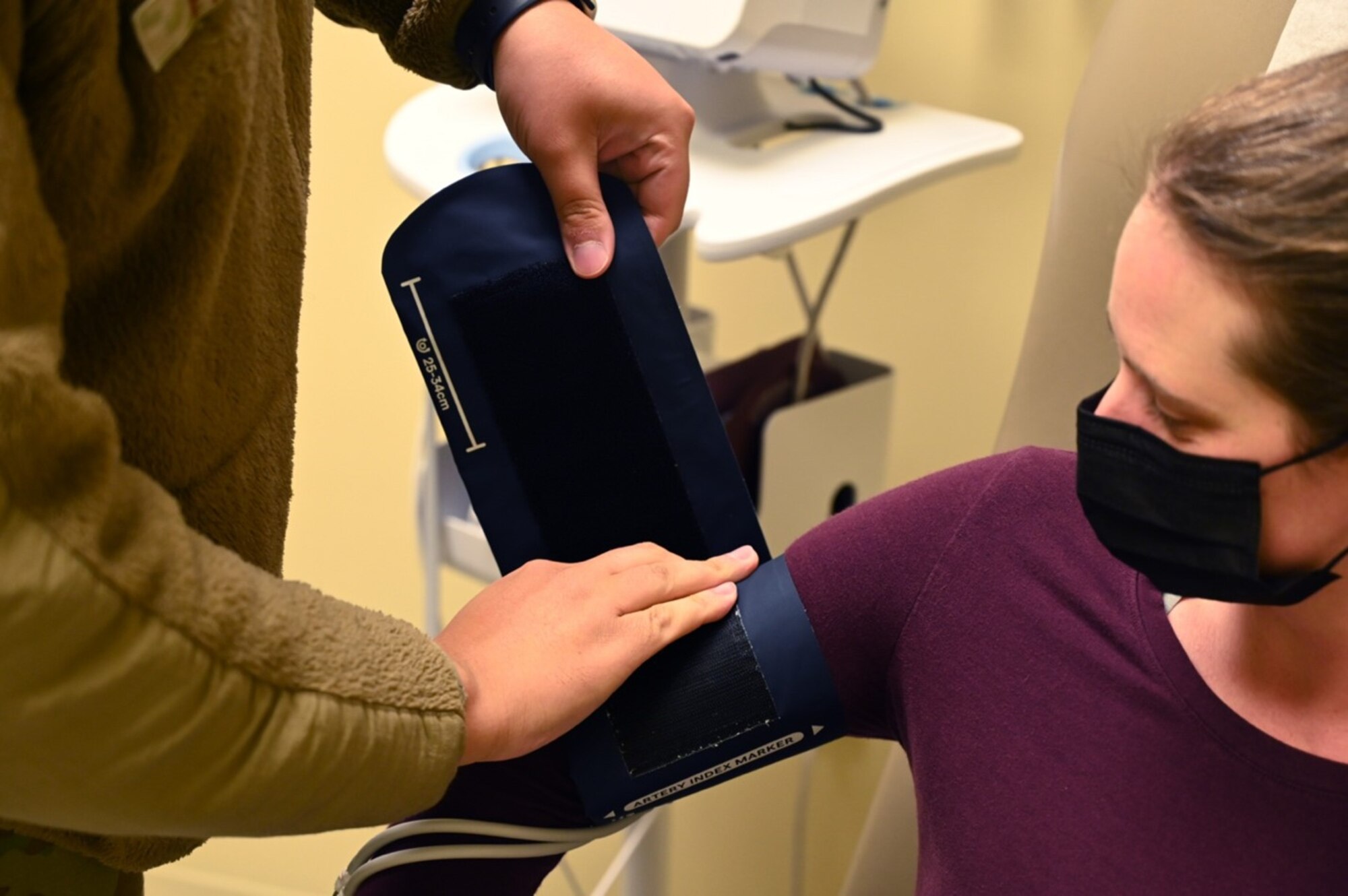 U.S. Air Force Senior Airman Javan Parker, a medical technician with the 62d Medical Squadron, takes a patient’s vitals at Joint Base Lewis-McChord, Washington, Feb. 3, 2023. The 62d MDS, located in the McChord Clinic, provides quality healthcare services to promote fit, resilient, and ready forces. (U.S. Air Force photo by Senior Airman Callie Norton)