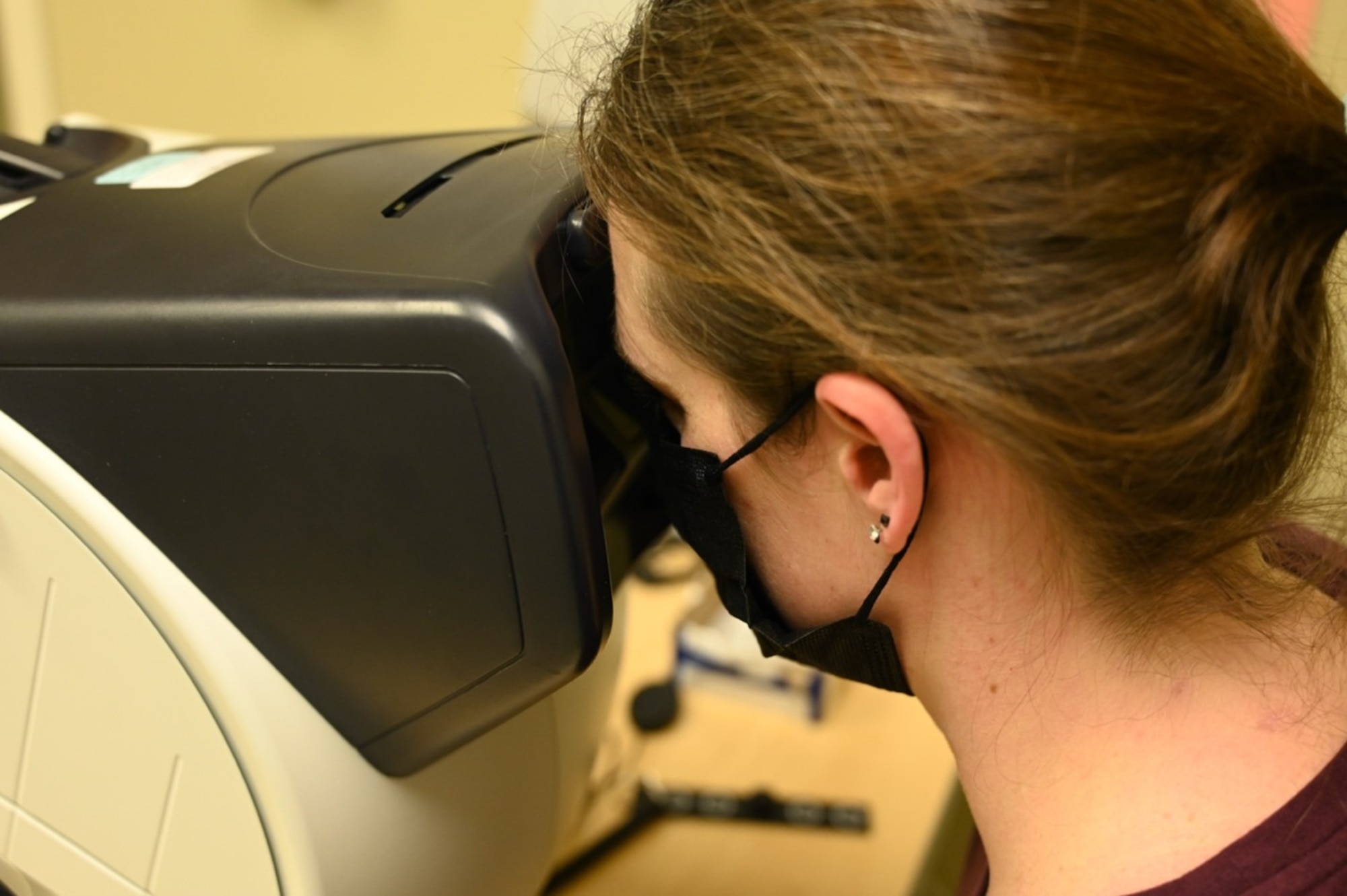 A patient participates in a distant visual acuity test at Joint Base Lewis-McChord, Washington, Feb. 3, 2023. The distant visual acuity test is used to determine the smallest letters one can read on a standardized chart. (U.S. Air Force photo by Senior Airman Callie Norton)