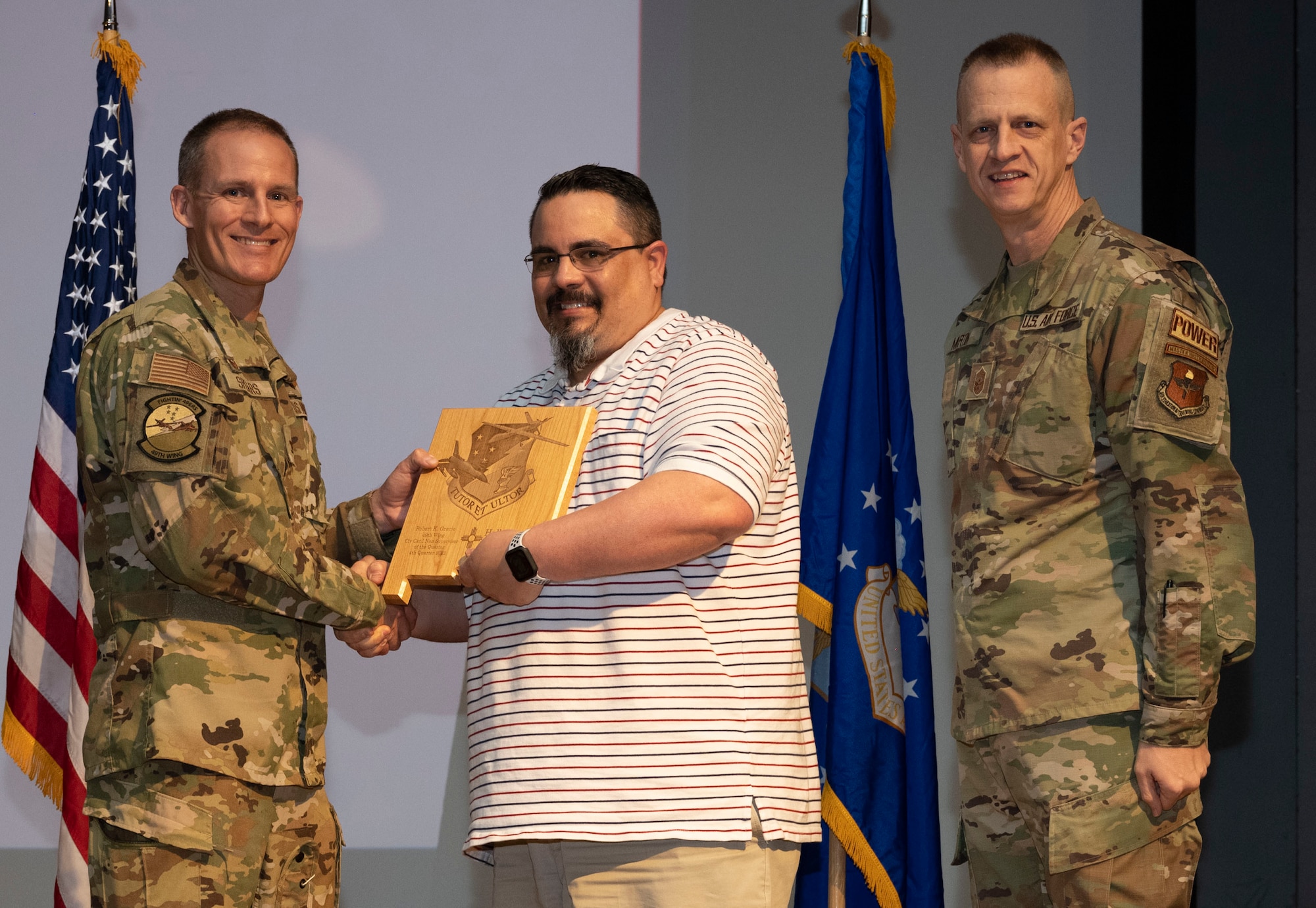 Robert Gracie, from the 16th Training Squadron, accepts the Civilian Category I (Non-supervisory) of the Quarter Award, during the 49th Wing’s 4th Quarter Award ceremony at Holloman Air Force Base, New Mexico, Feb. 2, 2023. Quarterly award winners were selected based on their technical expertise, demonstration of leadership and job performance. (U.S. Air Force photo by Senior Airman Antonio Salfran)