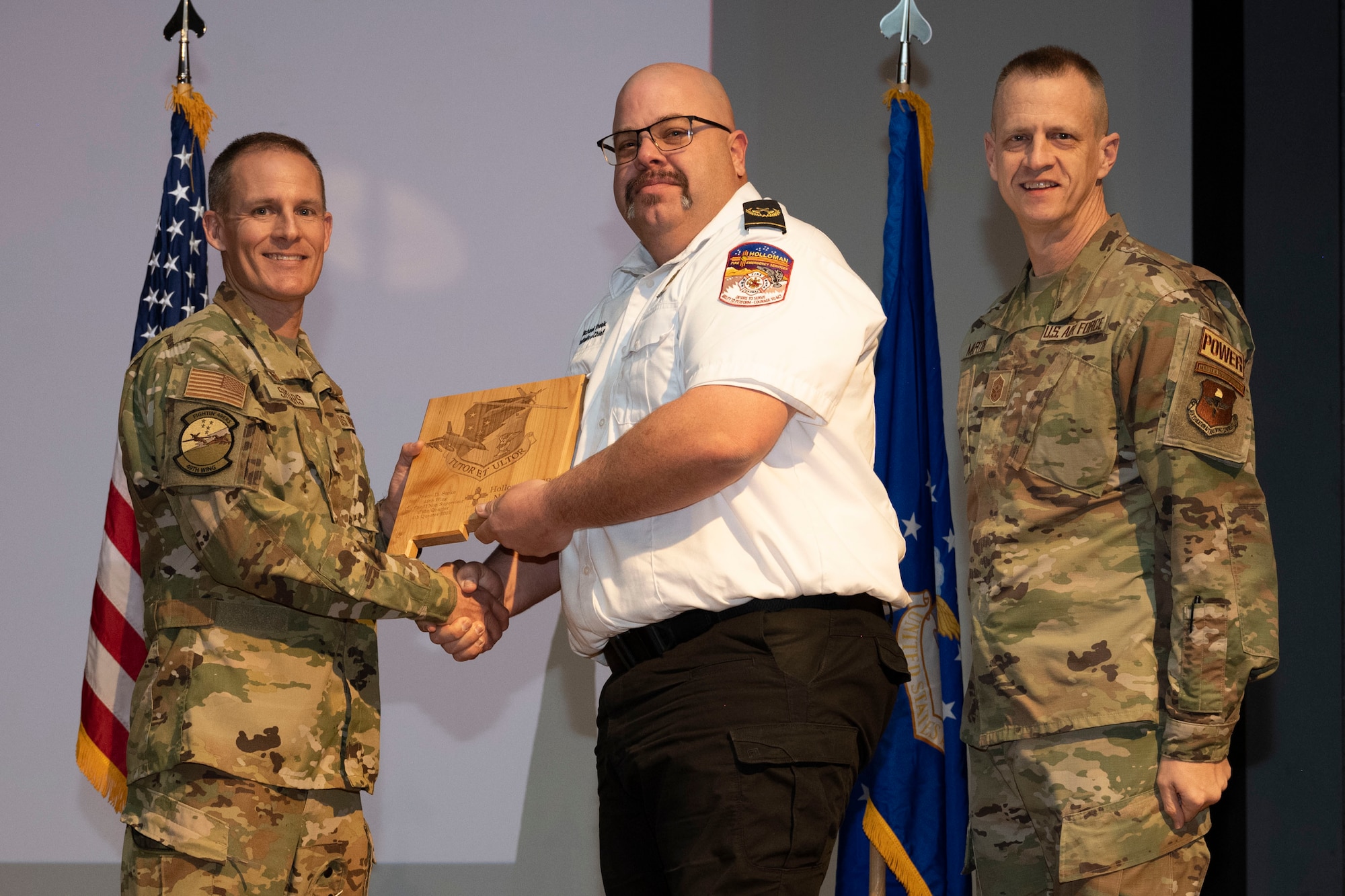 Michael Sheek, from the 49th Civil Engineering Squadron, accepts the Civilian Category II (Supervisory) of the Quarter Award, during the 49th Wing’s 4th Quarter Award ceremony at Holloman Air Force Base, New Mexico, Feb. 2, 2023. Quarterly award winners were selected based on their technical expertise, demonstration of leadership and job performance. (U.S. Air Force photo by Senior Airman Antonio Salfran)