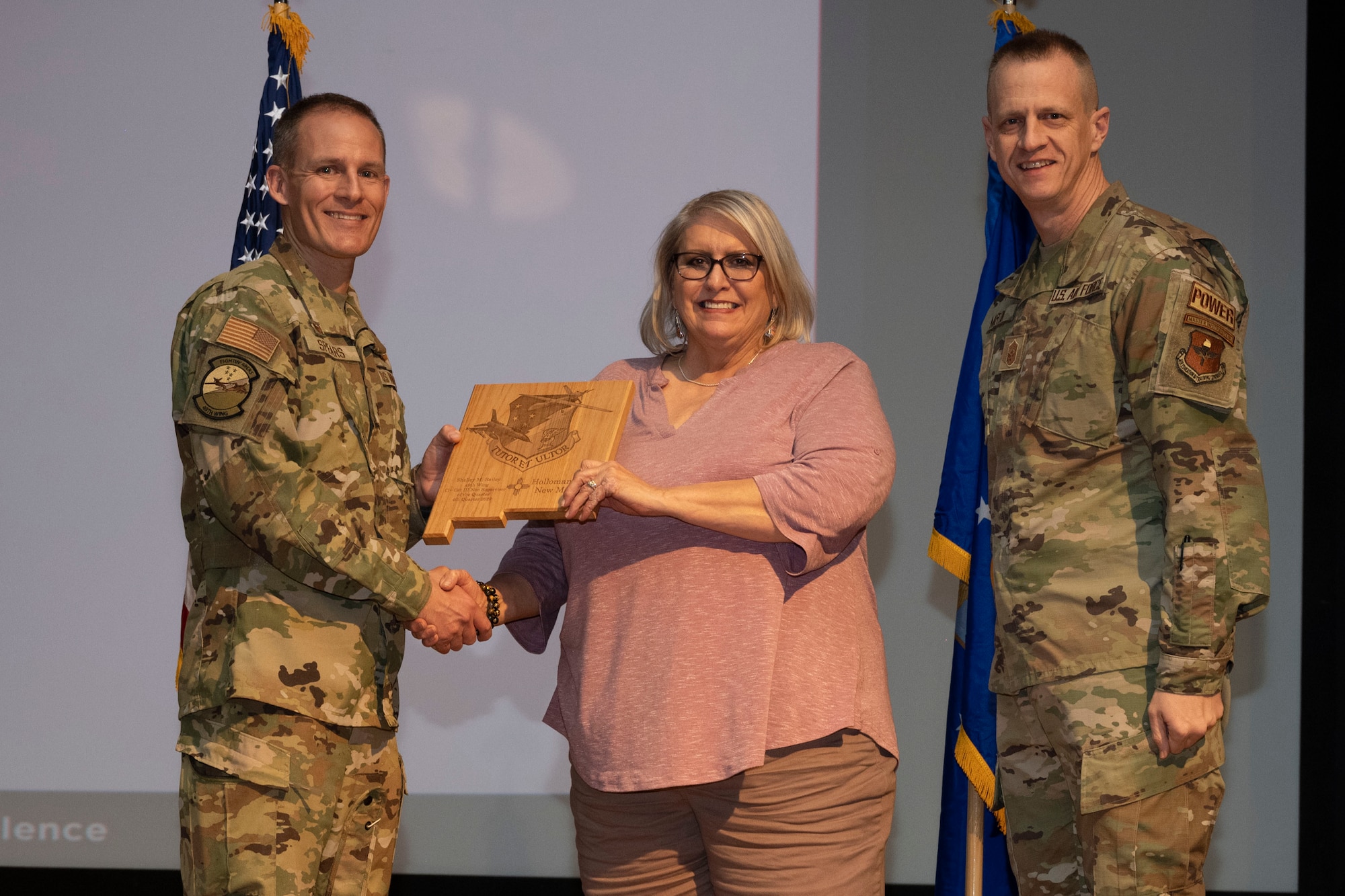 Shelley Bailey, from the 49th Wing Staff Agency, accepts the Civilian Category III (Non-supervisory) of the Quarter Award, during the 49th Wing’s 4th Quarter Award ceremony at Holloman Air Force Base, New Mexico, Feb. 2, 2023. Quarterly award winners were selected based on their technical expertise, demonstration of leadership and job performance. (U.S. Air Force photo by Senior Airman Antonio Salfran)