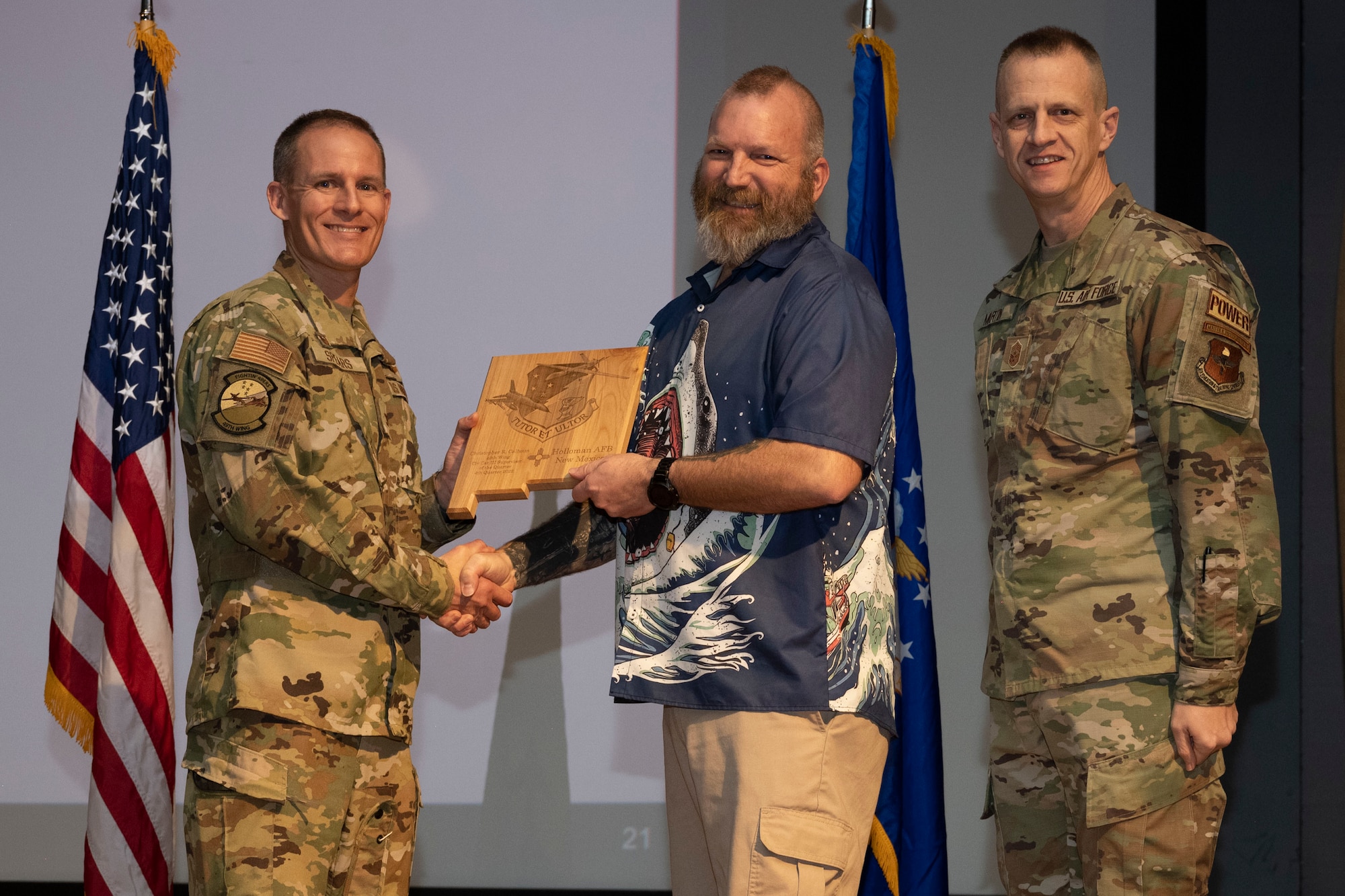 Christopher Calhoun, from the 49th Component Maintenance Squadron, accepts the Civilian Category III (Supervisory) of the Quarter Award, during the 49th Wing’s 4th Quarter Award ceremony at Holloman Air Force Base, New Mexico, Feb. 2, 2023. Quarterly award winners were selected based on their technical expertise, demonstration of leadership and job performance. (U.S. Air Force photo by Senior Airman Antonio Salfran)