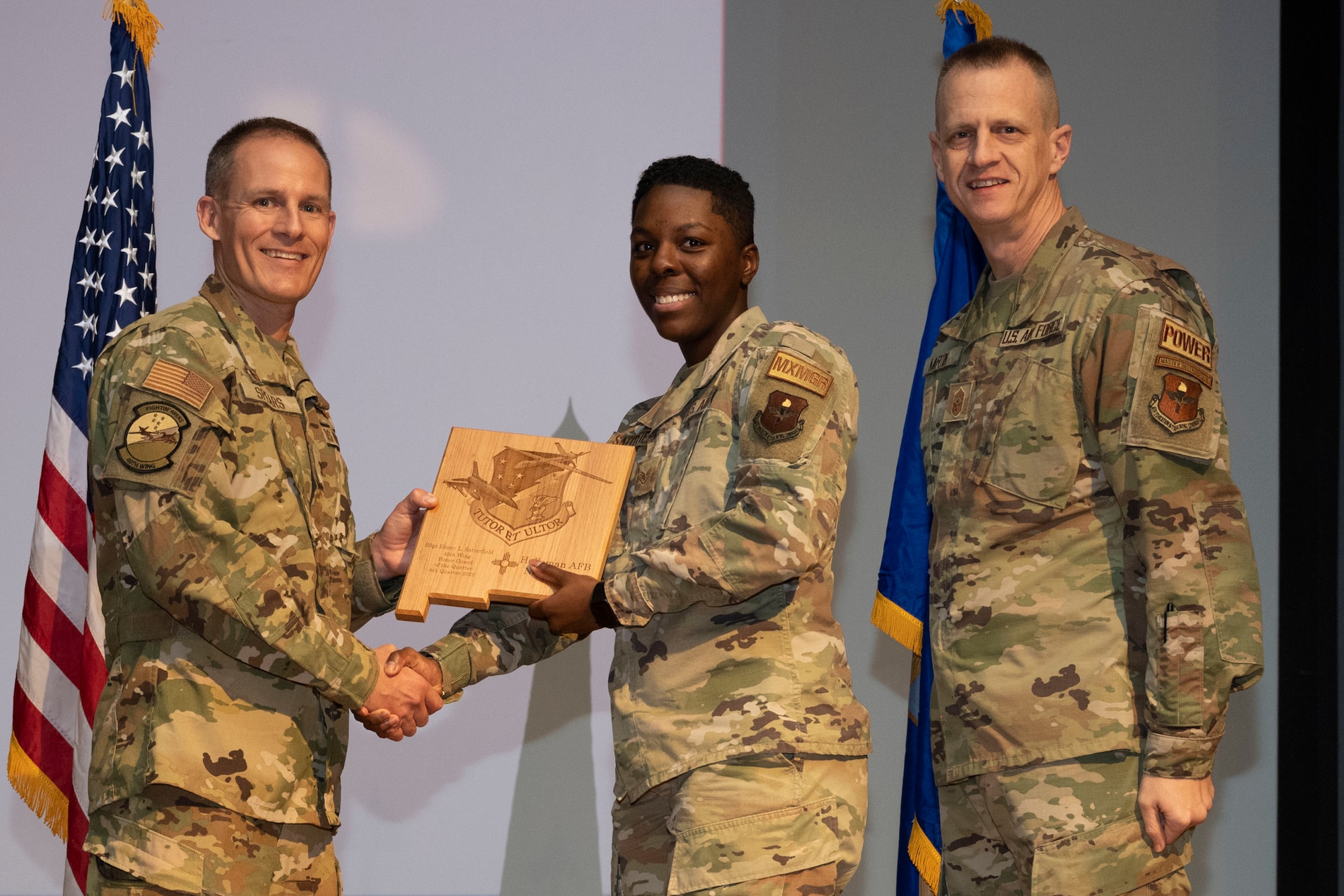 U.S. Air Force Staff Sgt. Ebony Satterfield, from the 49th Maintenance Operations Squadron, accepts the Honor Guardsman of the Quarter Award, during the 49th Wing’s 4th Quarter Award ceremony at Holloman Air Force Base, New Mexico, Feb. 2, 2023. Quarterly award winners were selected based on their technical expertise, demonstration of leadership and job performance. (U.S. Air Force photo by Senior Airman Antonio Salfran)