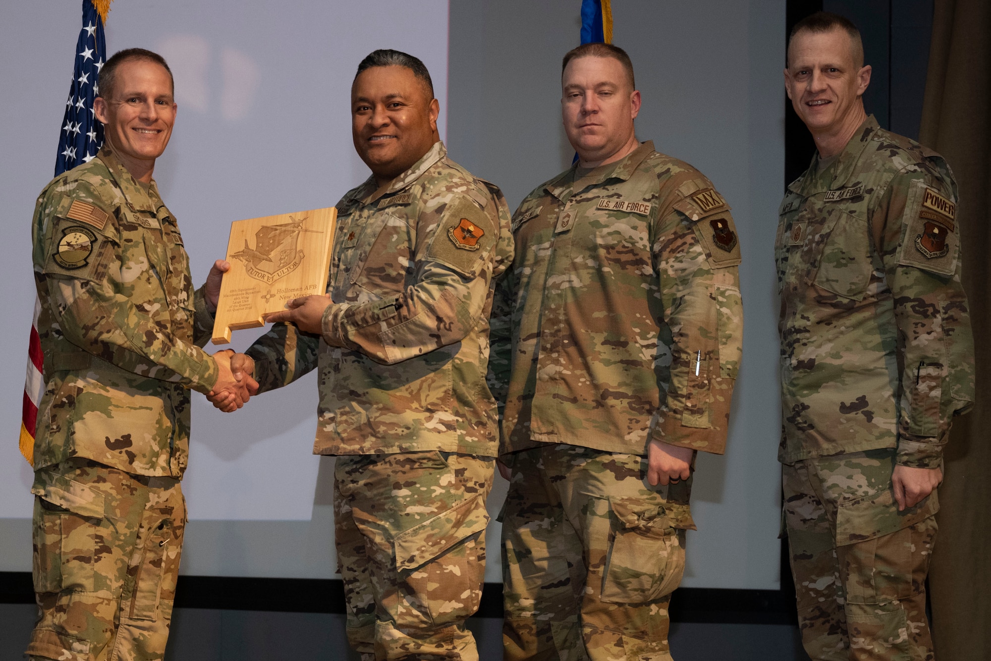 The 49th Equipment Maintenance Squadron accepts the Large Unit of the Quarter Award, during the 49th Wing’s 4th Quarter Award ceremony at Holloman Air Force Base, New Mexico, Feb. 2, 2023. Quarterly award winners were selected based on their technical expertise, demonstration of leadership and job performance. (U.S. Air Force photo by Senior Airman Antonio Salfran)