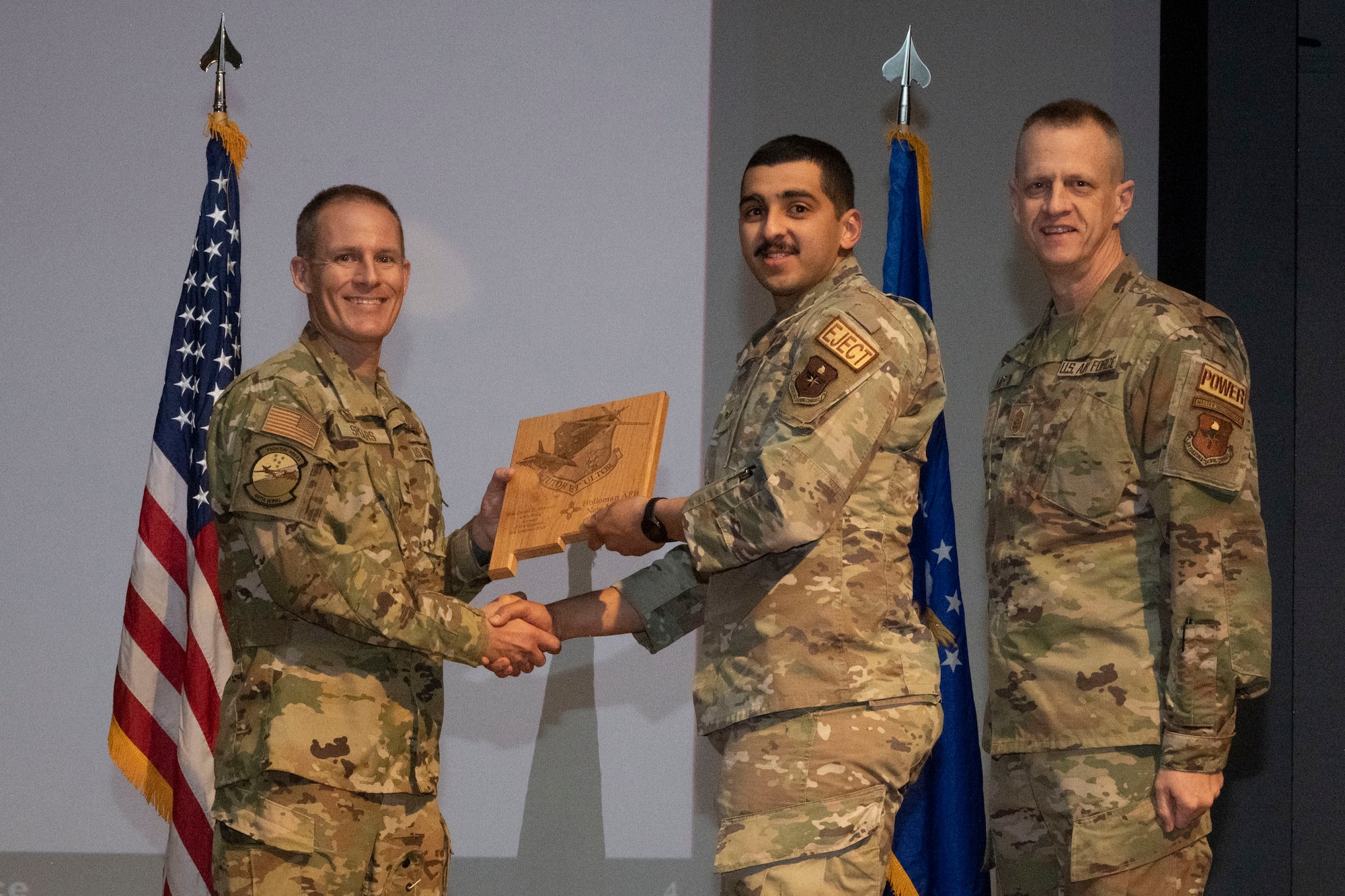 U.S. Air Force Senior Airman David Morales, from the49th Component Maintenance Squadron, accepts the Airman of the Quarter Award, during the 49th Wing’s 4th Quarter Award ceremony at Holloman Air Force Base, New Mexico, Feb. 2, 2023. Quarterly award winners were selected based on their technical expertise, demonstration of leadership and job performance. (U.S. Air Force photo by Senior Airman Antonio Salfran)