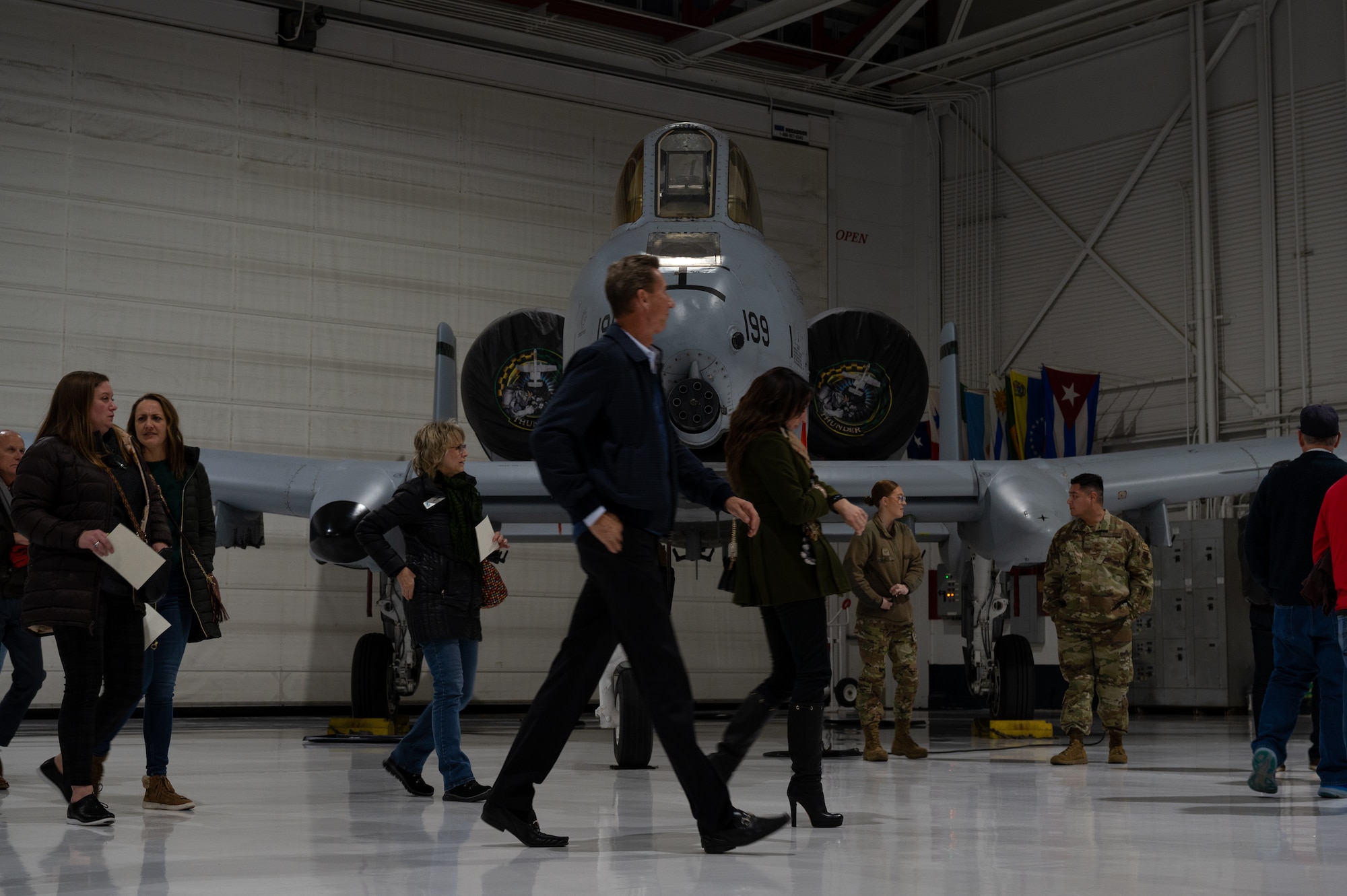 civilians walk in front of A-10