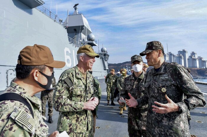 230202-N-SO091-318 BUSAN, Republic of Korea (Feb. 2, 2023) Vice Admiral Kim Jung-soo, Commander Republic of Korea Fleet leads Vice Adm. Karl Thomas, Commander, US 7th Fleet and Staff on a tour of the flight deck aboard the Republic of Korea Navy Dokdo-class Amphibious Assault Ship ROKS Marado (LPH-6112) in Busan, ROK. Vice Adm. Thomas is in the Republic of Korea to attend the 7th annual Anti-submarine Warfare Cooperation Committee meeting. (Courtesy photo by Commander, ROK Fleet Public Affairs)