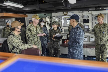 230202-N-ZU710-0079 BUSAN, Republic of Korea (Feb. 2, 2023) Vice Adm. Karl Thomas, commander, U.S. 7th Fleet, tours the pilothouse aboard the Republic of Korea (ROK) Navy Dokdo-class amphibious assault ship ROKS Marado (LPH-6112) in Busan, ROK. Vice Adm. Thomas is in the Republic of Korea to attend the 7th annual Anti-submarine Warfare Cooperation Committee meeting. (U.S. Navy photo by Mass Communication Specialist 2nd Class Michael Chen)