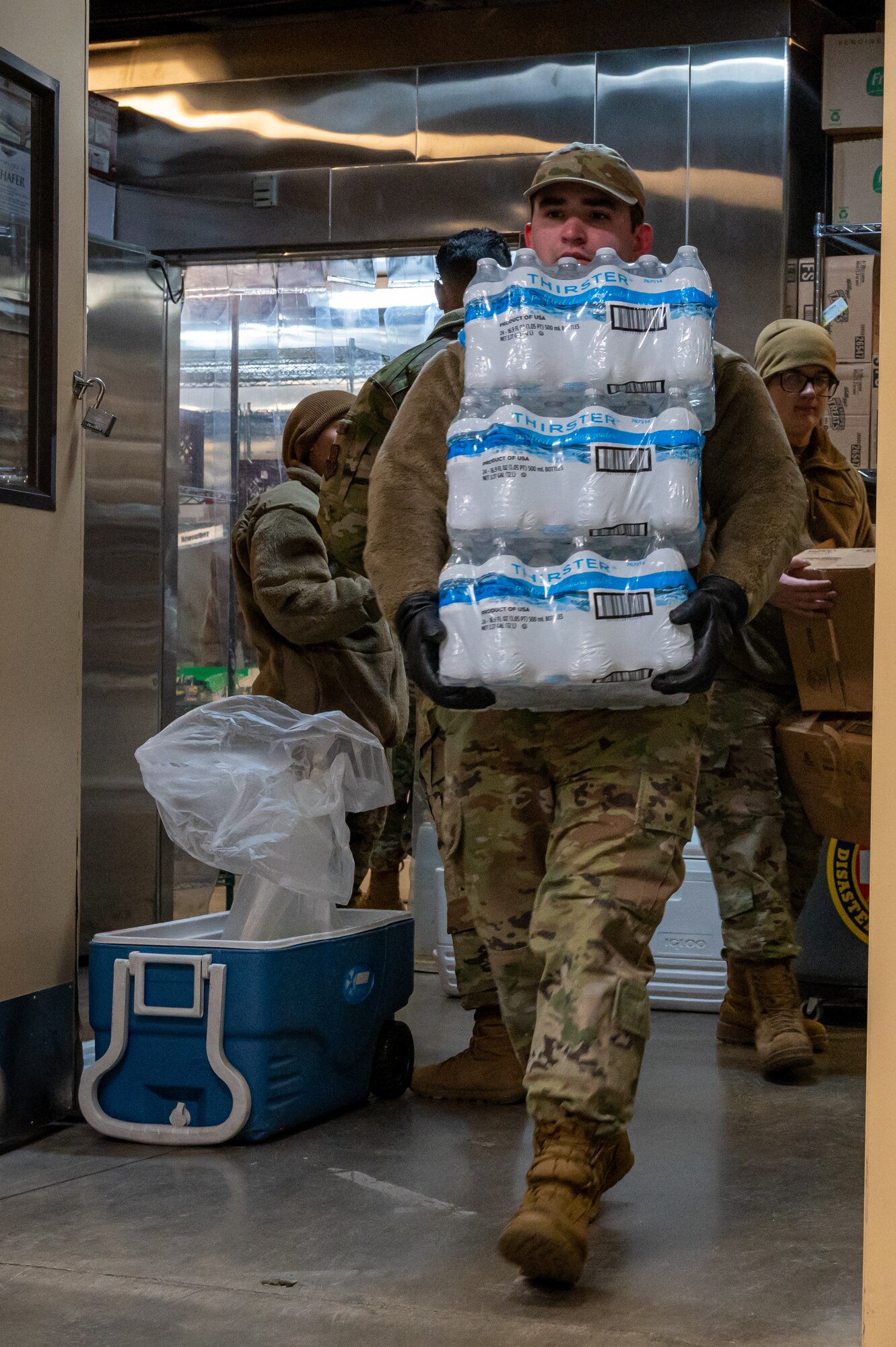 U.S. Airmen from the 5th Force Support Squadron pack supplies for use by chefs deployed to remote Missile Alert Facilities (MAFs) at Minot Air Force Base, North Dakota, Jan. 30, 2023. Airmen not deployed to a MAF pack rations to be delivered quickly to the missile sites around Minot, some sites reaching up to 75 miles away. (U.S. Air Force photo by Airman 1st Class Alexander Nottingham)