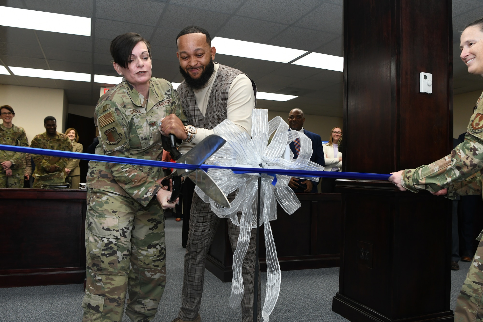 people cutting ribbon