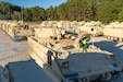 Tactical vehicles lined in rows.