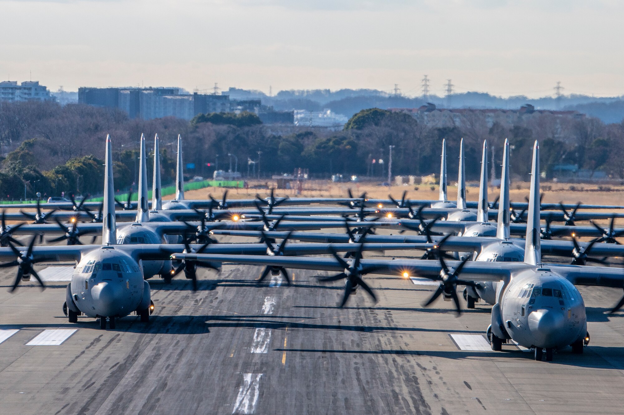 eight cargo planes line up for take off