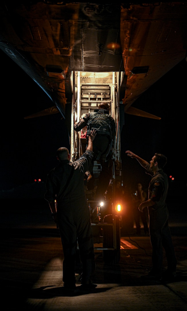 U.S. Airmen from the 34th Expeditionary Bomb Squadron assist aircrew with post flight procedures after arriving for a Bomber Task Force deployment at Andersen Air Force Base, Guam, Feb. 1, 2023.
