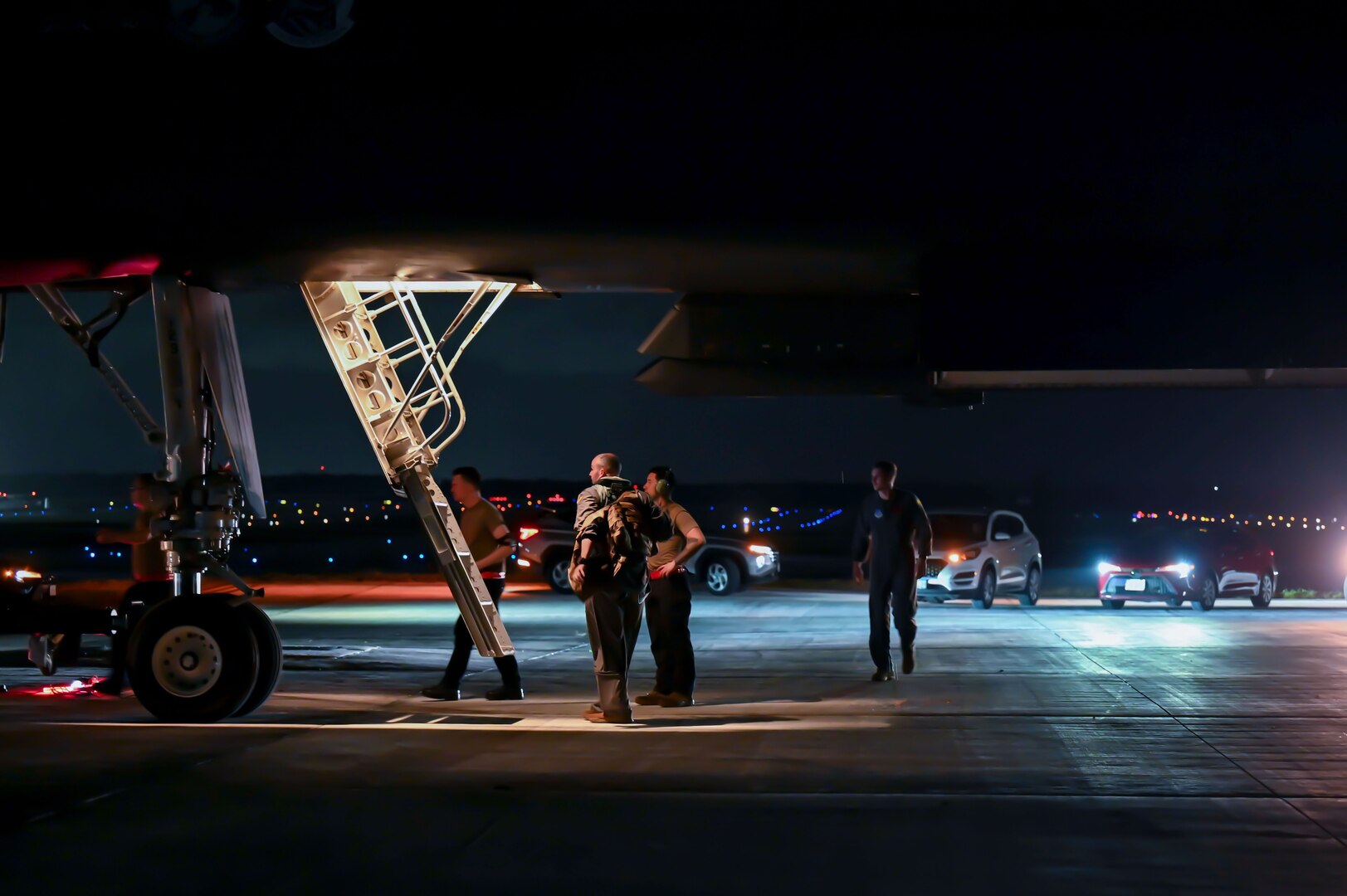 U.S. Airmen from the 34th Expeditionary Bomb Squadron assist aircrew with post-flight procedures after arriving for a Bomber Task Force deployment at Andersen Air Force Base, Guam, Feb. 1, 2023.