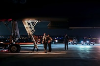 U.S. Airmen from the 34th Expeditionary Bomb Squadron assist aircrew with post-flight procedures after arriving for a Bomber Task Force deployment at Andersen Air Force Base, Guam, Feb. 1, 2023.