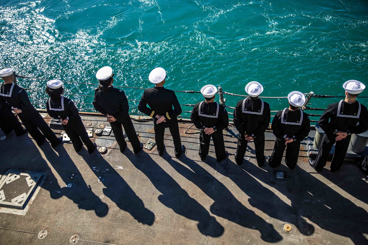 Sailors man the rails aboard the Arleigh Burke-class guided-missile destroyer USS Roosevelt (DDG 80) as the ship returns from patrol to Naval Station Rota, Feb. 4, 2023.