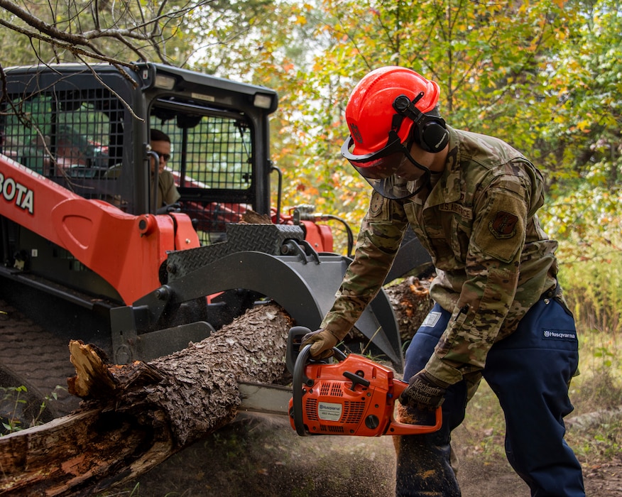 An Airman from the 166th Airlift Wing Civil Engineer Squadron trains with a chainsaw