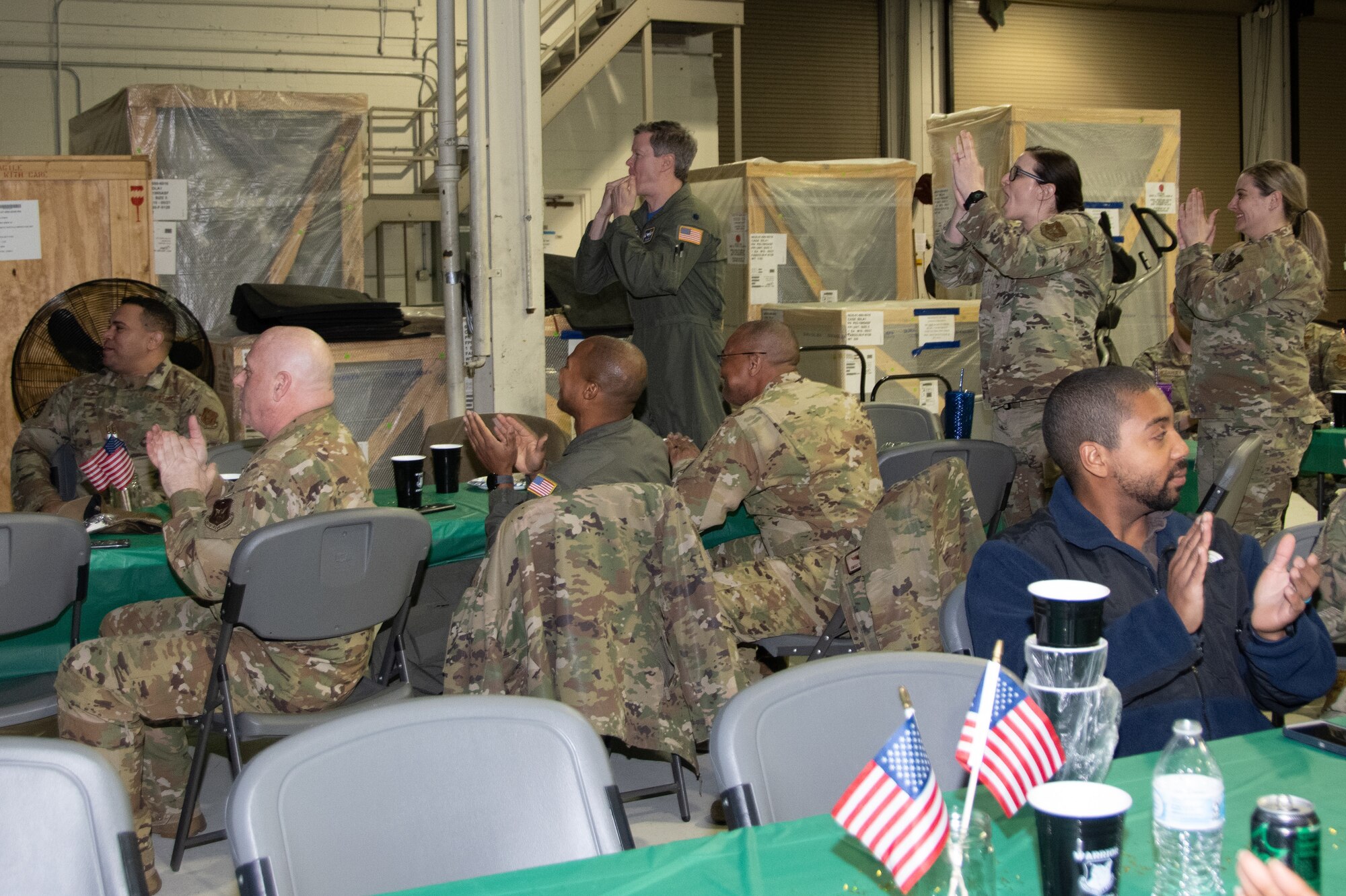 Members of the 512th Airlift Wing celebrate award winners at the wing’s Warrior Awards Feb. 4, 2023 at Dover Air Force Base, Delaware. Airmen cheered the winners by using noise makers and shouting squadron chants. (U.S. Air Force photo by Senior Airman Kalee Sexton)