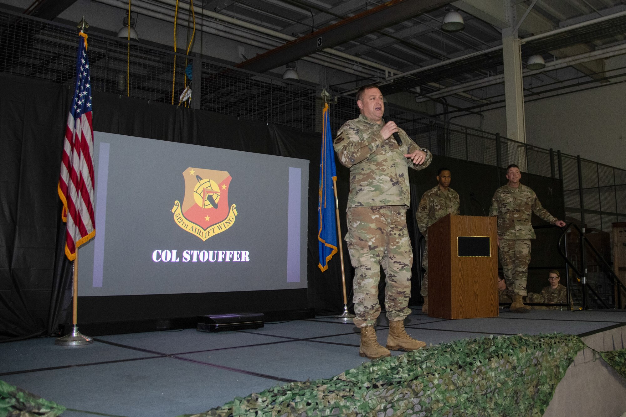 Col. Douglas Stouffer, 512th Airlift Wing commander, gives opening remarks at the wing’s Warrior Awards Feb. 4, 2023, at Dover Air Force Base, Delaware. The event was the first in-person function in two years, allowing Airmen to come together in celebration of their wingmen’s accomplishments. (U.S. Air Force photo by Senior Airman Kalee Sexton)