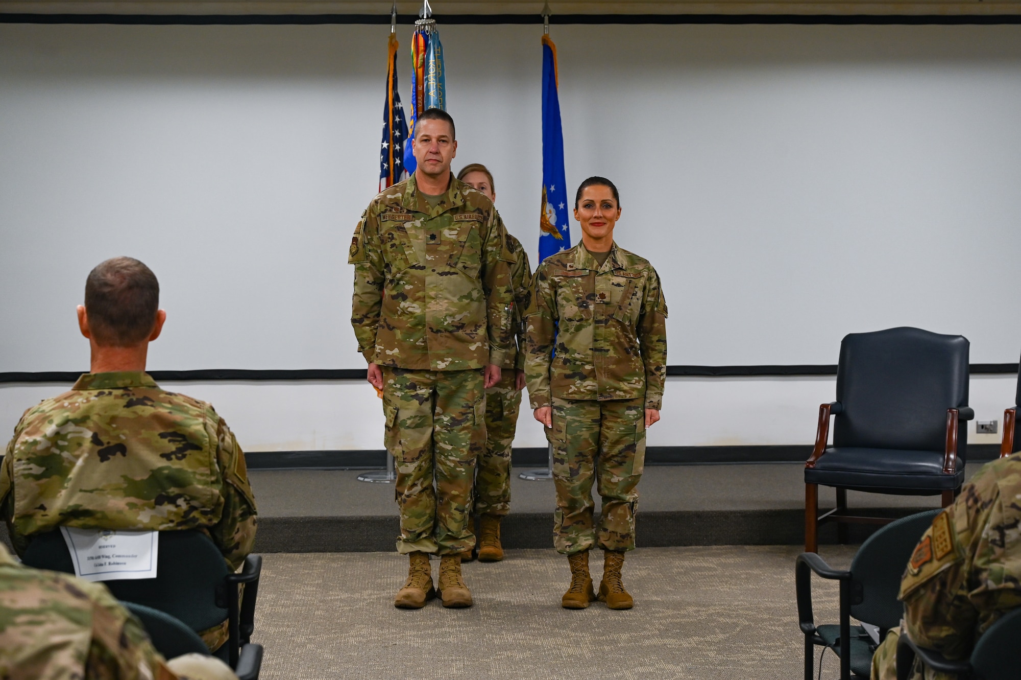 U.S. Air Force Lt. Col. Robert Wengerter, commander of the 315th Mission Support Group, and Maj. Bobbie-Jean Johnson, Commander of the 315th Force Support Squadron stand for a change of command ceremony Feb. 4, 2023, at Joint Base Charleston, South Carolina. The change of command ceremony is a military tradition representing a handover of authorities and responsibilities within a unit or command. (U.S. Air Force photo by Staff Sgt. Haley D. Phillips)
