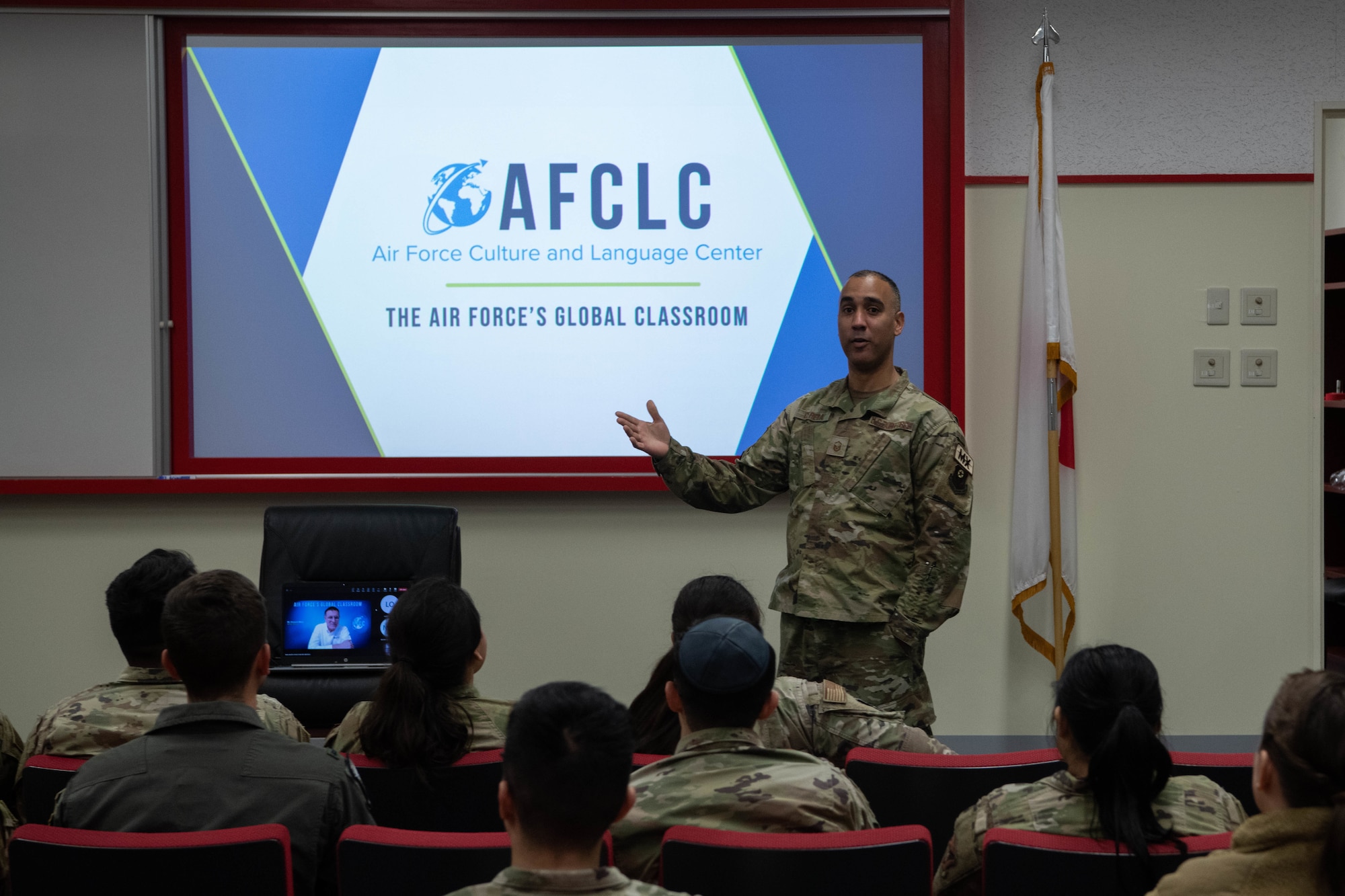 An Airman opens a presentation.