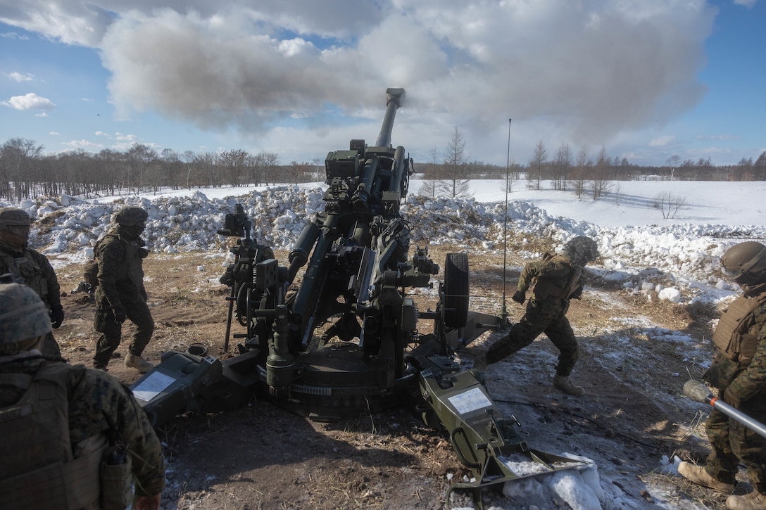 U.S. Marines with 3d Battalion, 12th Marines fire an M777 towed 155 mm howitzer while conducting live-fire training during Artillery Relocation Training Program 22.4 at the Yausubetsu Maneuver Area, Hokkaido, Japan, Jan. 31, 2023.