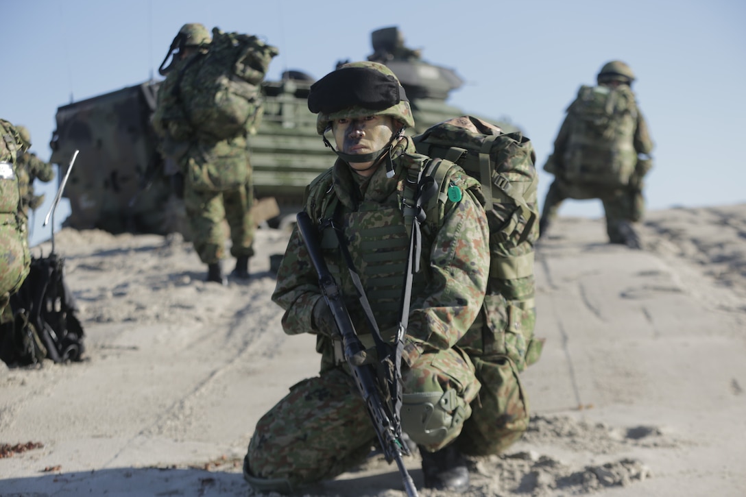 A Japanese Soldier, with the Western Army Infantry Regiment, Japan Ground Self Defense Force, provides rear security for his squad during amphibious assault training during Exercise Iron Fist 2018, Feb. 5. Iron Fist is an annual, bilateral amphibious training exercise held in Southern California between the U.S. Marine Corps and the JGSDF. The Japanese Soldiers and U.S. Marines have trained together in Southern California via this annual, bilateral exercise for 13 consecutive years.