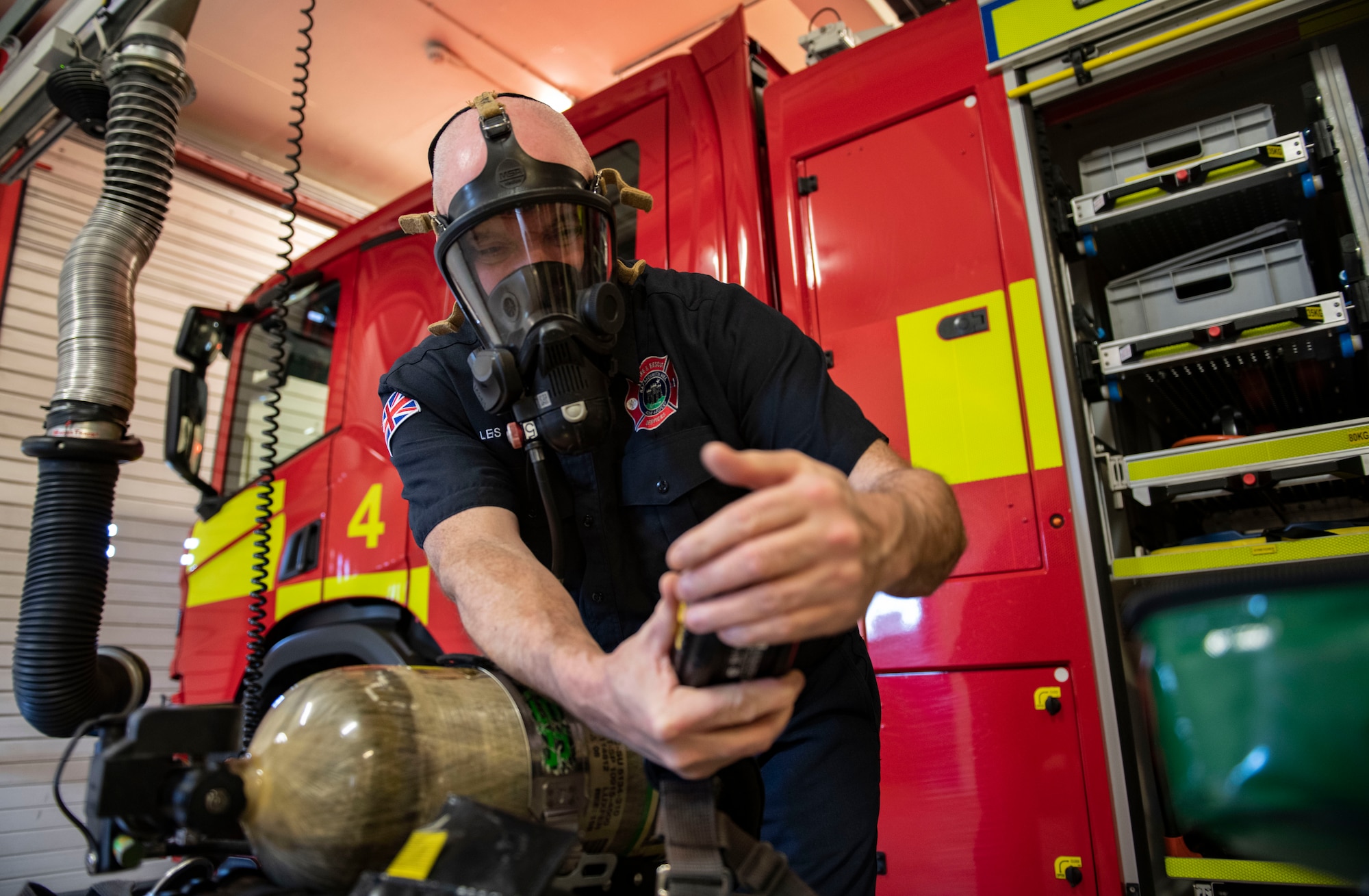 Les Dodds, 421st Air Base Squadron firefighter checks the performance of a breathing apparatus at RAF Menwith Hill, England, Jan. 30, 2023. This department had just won the USAFE small fire department of the year and fire prevention program of the year. (U.S. Air Force photo by Senior Airman Jason W. Cochran)