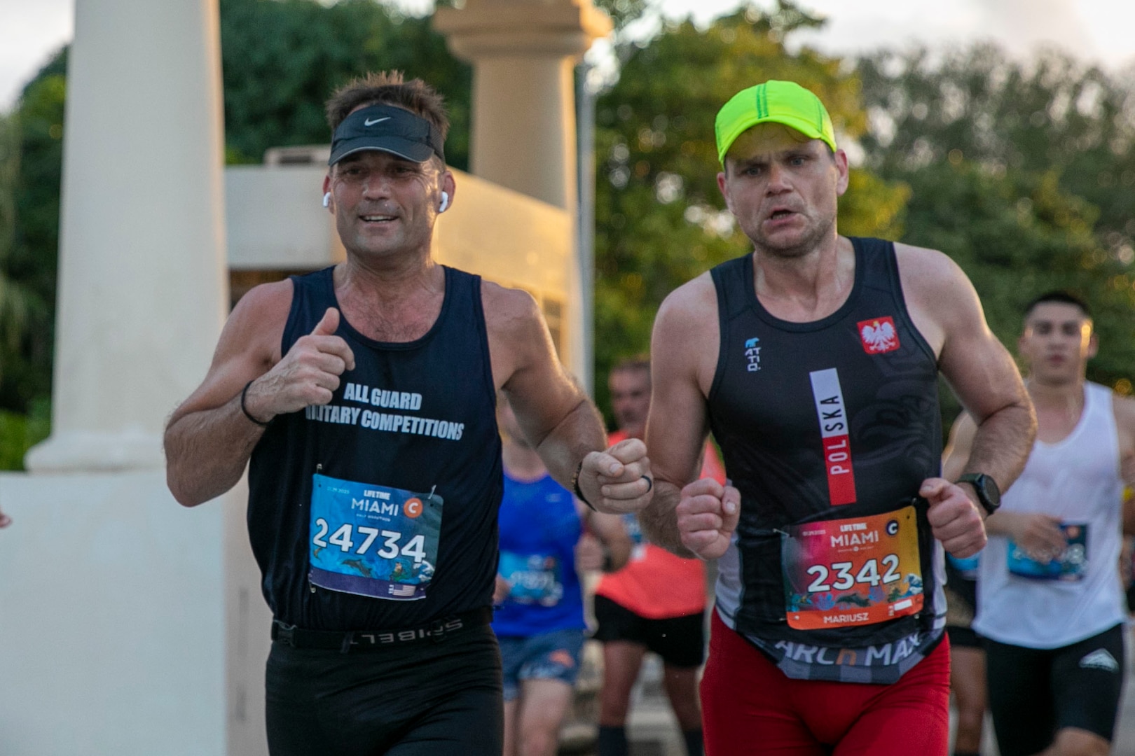 Maj. Jeffrey Kragh (left), All Guard Marathon Team, Oklahoma National Guard, runs in the 2023 Life Time Miami Marathon and Half in Miami, Florida, Jan. 29, 2023. More than two dozen National Guard Soldiers from 17 states competed in the marathon. (U.S. Army National Guard photo by Sgt. Gauret Stearns)