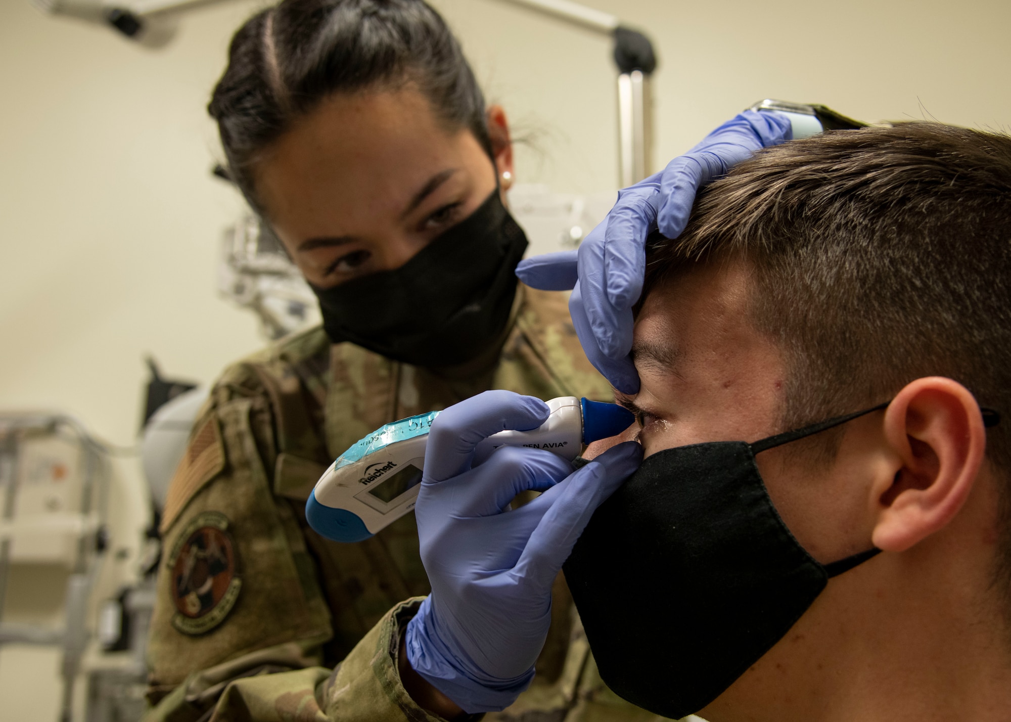 Airman 1st Class Samantha Sim, 59th Surgical Operations Squadron ophthalmic technician, measures eye pressure of a patient at the Ophthalmology Clinic in Wilford Hall Ambulatory Surgical Center, Joint Base San Antonio-Lackland, Jan. 19, 2023. The 59th SGC tests and treats to prevent vision loss, promote a better quality of life and support a worldwide qualified force. (U.S. Air Force photo by Senior Airman Melody Bordeaux)