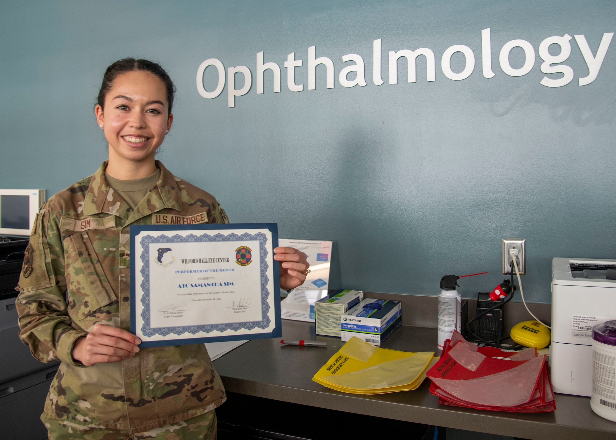 Airman 1st Class Samantha Sim, 59th Surgical Operations Squadron ophthalmic technician, poses for a photo at the Ophthalmology Clinic in Wilford Hall Ambulatory Surgical Center, Joint Base San Antonio-Lackland, Jan. 19, 2023. The 59th SGC tests and treats to prevent vision loss, promote a better quality of life and support a worldwide qualified force. (U.S. Air Force photo by Senior Airman Melody Bordeaux)