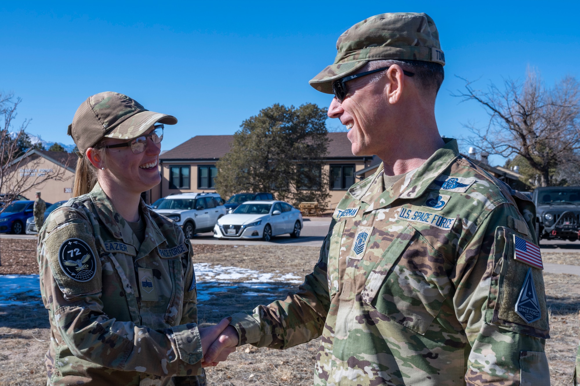 Chief Towberman shaking hands with a Guardian