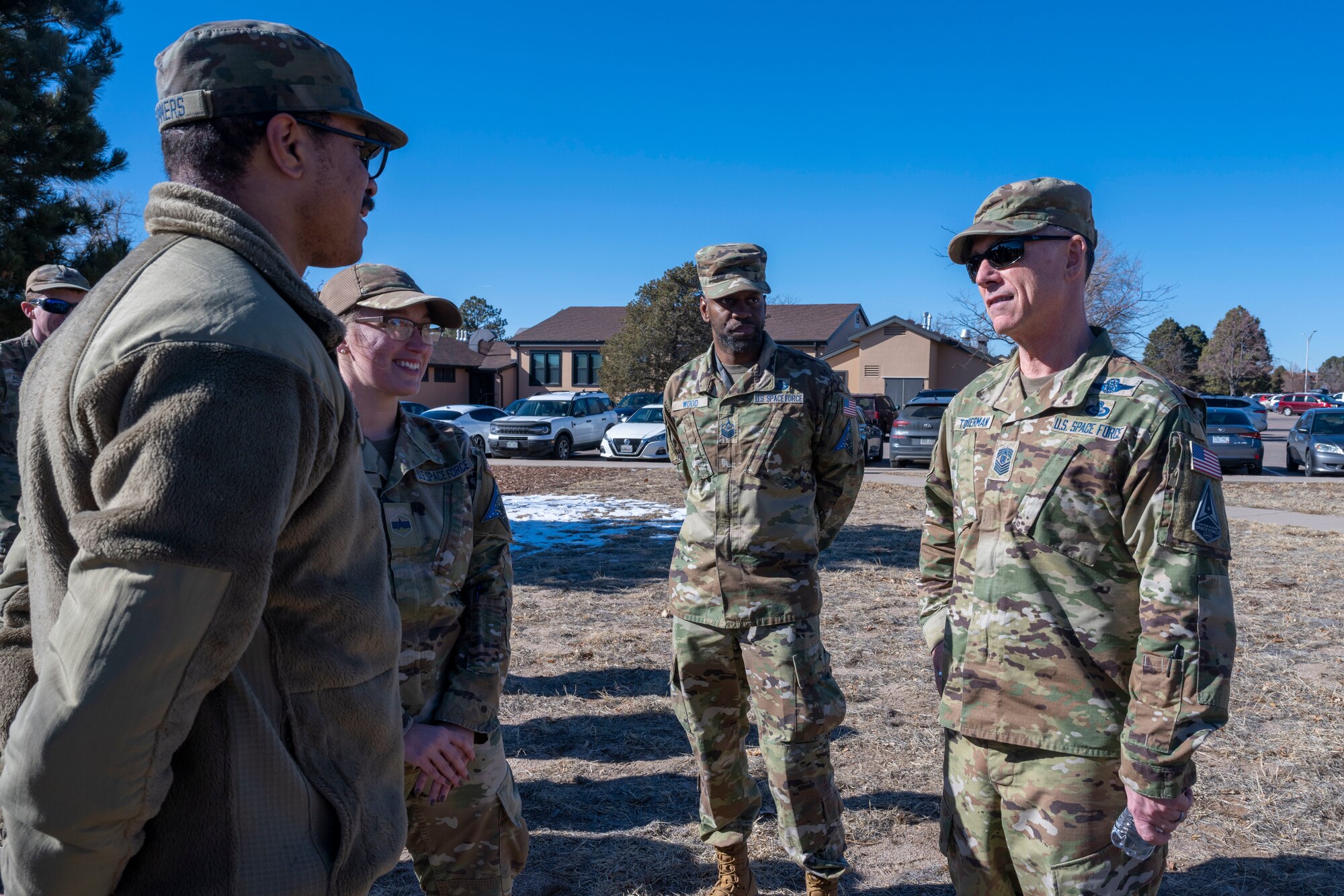 Uniformed personnel speaking in a group