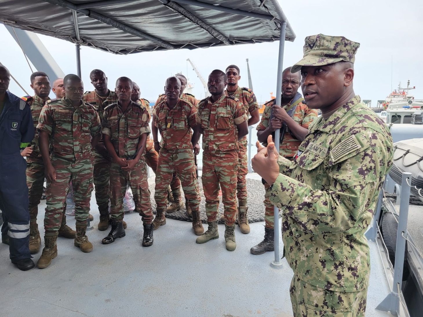 LAGOS, Nigeria - Hospital Corpsman 1st Class Agossou Marcellin, right, a Benin native, pharmaceutical doctorate student, and U.S. Navy Reservist, returns to Benin during Obangame Express 2023.