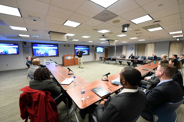 Chief of Naval Research Rear Adm. Lorin Selby addresses the incoming group of the  Navy Legislative Fellows program at the Office of Naval Research headquarters in Arlington, Virginia. The Navy Legislative Fellows program provides an opportunity for Navy, civilian, officers and senior enlisted to broaden their experience and knowledge in the operations and organization of Congress while enhancing the Navy's ability to fulfill its role in the national policy development process.  The fellowship consists of a year-long full-time assignment to the office of a U.S. Congressional member, either in the Senate or the House of Representatives, who serves on a defense-related committee. The Fellow serves as a member of the staff and is assigned duties and tasks based on the needs of the office.