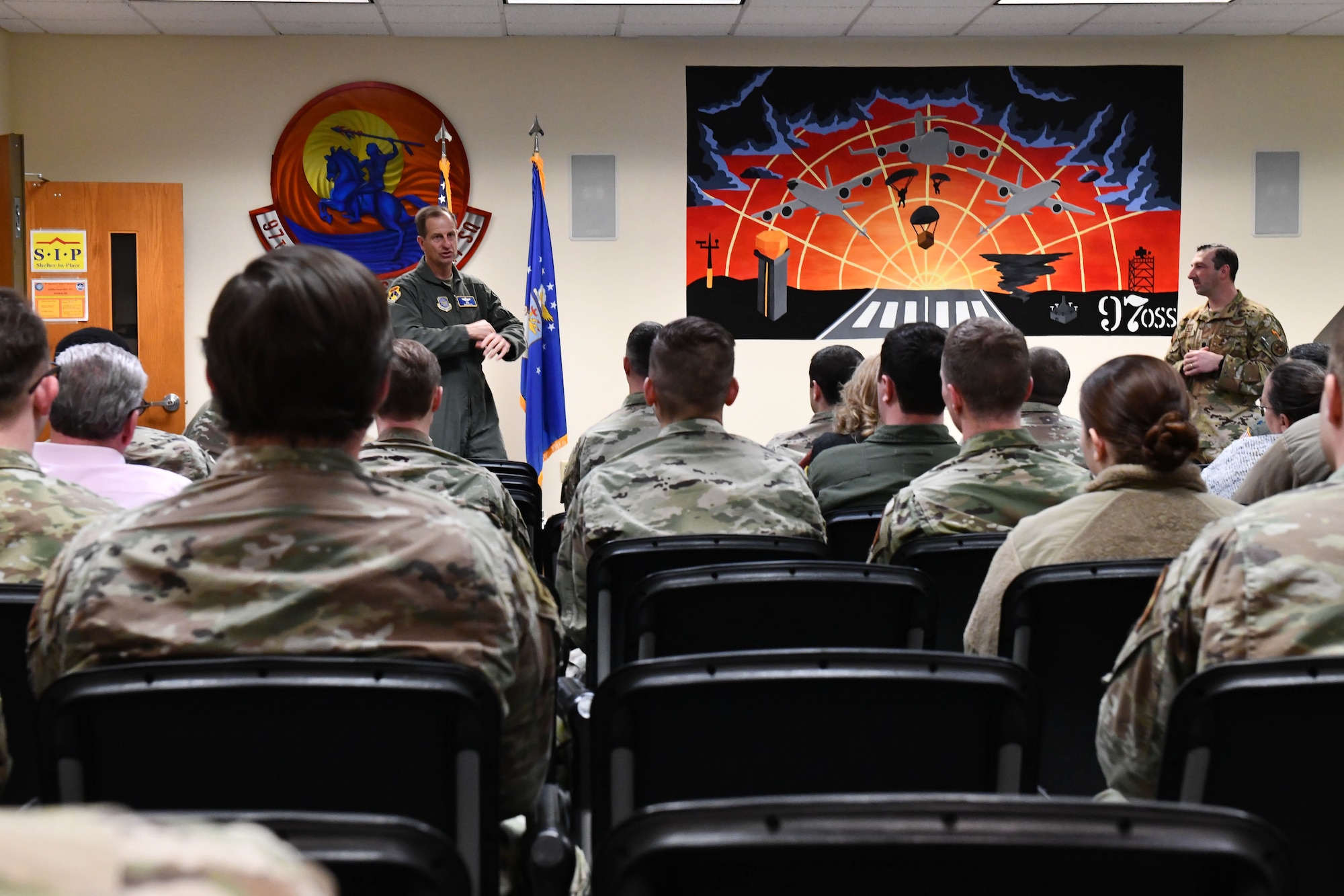 U.S. Air Force Maj. Gen. Corey J. Martin, 18th Air Force commander, speaks to members of the 97th Operation Support Squadron (OSS) at Altus Air Force Base, Oklahoma, Jan. 26, 2023. The 97th OSS provides direct support to two flying squadrons and operates six flights including airfield operations, current operations, aircrew flight equipment, intelligence, tactics and weather. (U.S. Air Force photo by Airman 1st Class Miyah Gray)