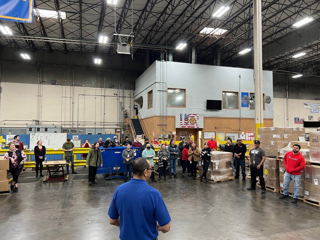 Matthew Wadleigh gives a speech during a celebration to recognize the UGR team’s 100th month of successfully fulfilling the war reserve requirements