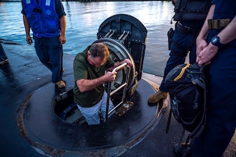 U.S. Representative Ed Case, Hawaii's First Congressional District, embarks the Virginia-class fast-attack submarine USS North Carolina (SSN 777) before touring the boat off the coast of Pearl Harbor, Hawaii, Jan. 15, 2023. USS North Carolina is the fourth submarine of the Virginia-class; the first class designated and built post-Cold War in order to meet the challenges of the 21st century, and has improved stealth; sophisticated surveillance capabilities, and special warfare enhancements that enable it to meet the Navy's multi-mission requirements. (U.S. Navy photo by Mass Communication Specialist 1st Class Scott Barnes)