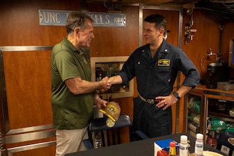 U.S. Representative Ed Case, Hawaii's First Congressional District, shakes hands with Cmdr. Tad Robbins, commanding officer of the Virginia-class fast-attack submarine USS North Carolina (SSN 777), while touring the North Carolina off the coast of Pearl Harbor, Hawaii, Jan. 15, 2023. USS North Carolina is the fourth submarine of the Virginia-class; the first class designated and built post-Cold War in order to meet the challenges of the 21st century, and has improved stealth; sophisticated surveillance capabilities, and special warfare enhancements that enable it to meet the Navy's multi-mission requirements. (U.S. Navy photo by Mass Communication Specialist 1st Class Scott Barnes)