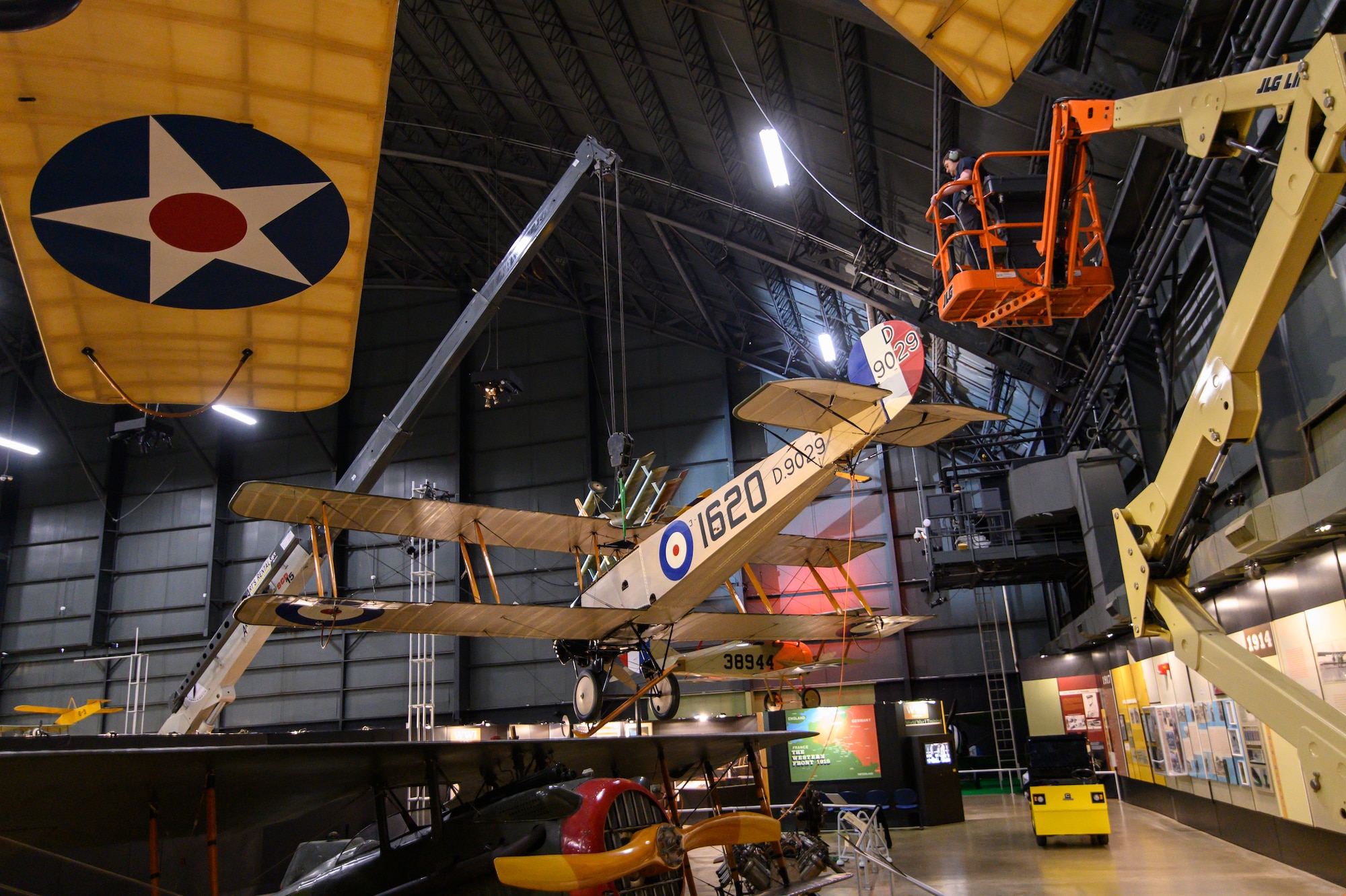 Avro 504K being lifted into position by a crane.