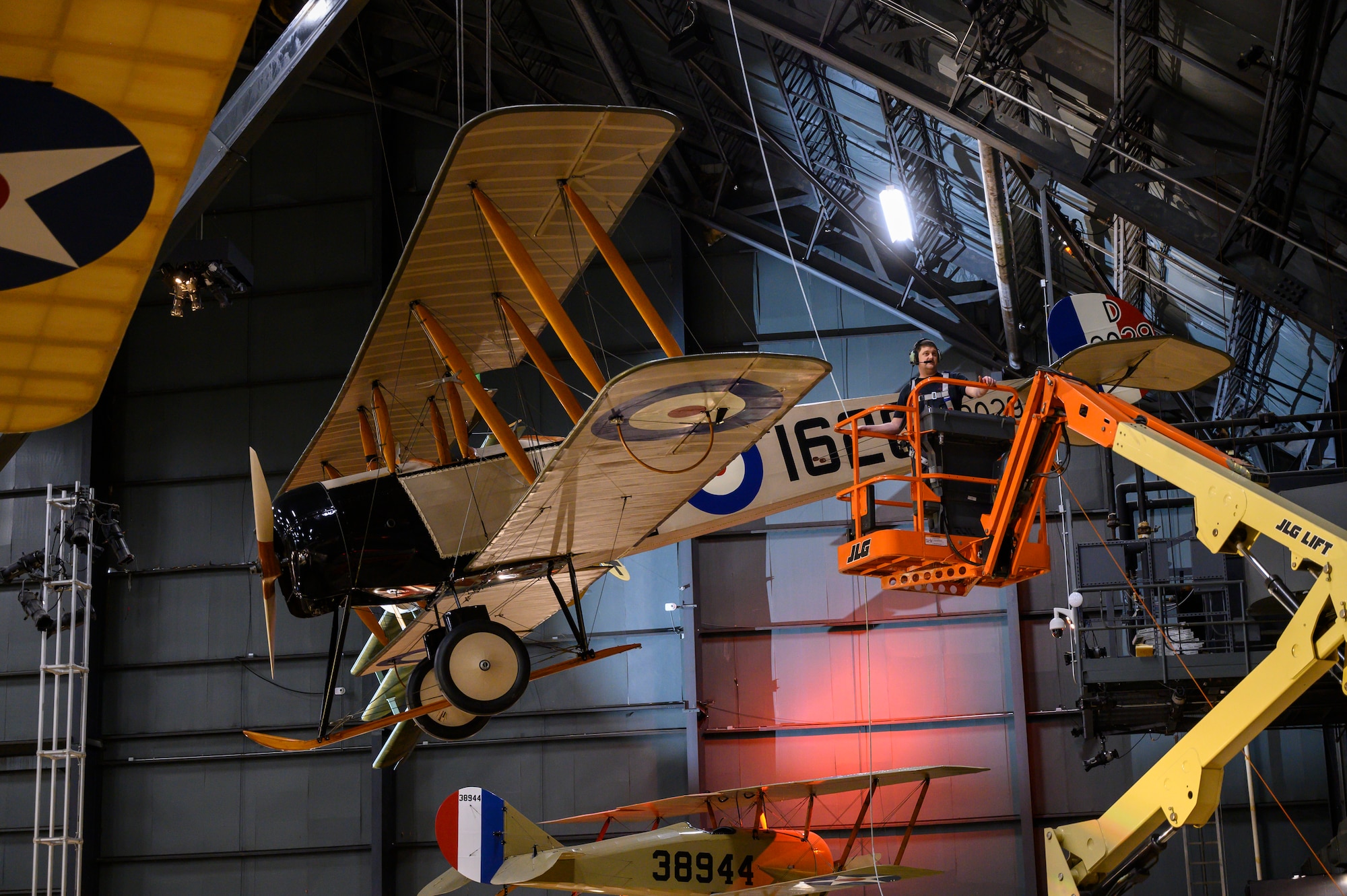 Avro 504K being lifted into position by a crane.