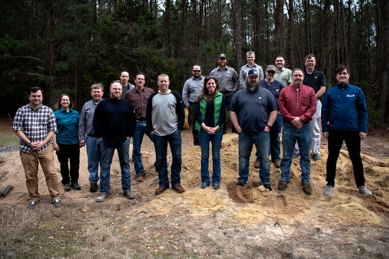 Personnel from the Richard B. Russell Dam and the Savannah District home office pose for a group photo after a sandbag demonstration during dam safety training at the Russell Dam on Feb. 1, 2023. USACE photo by Mel Orr.