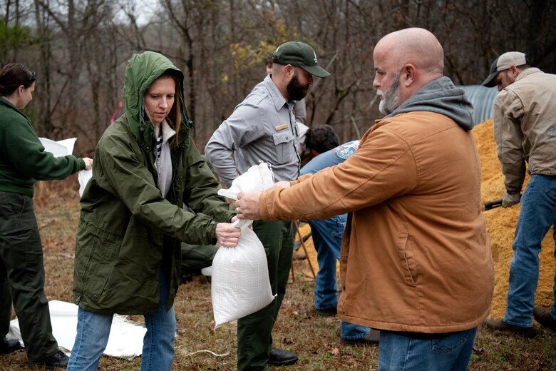 Christi White, equipment specialist, left, and Don Knopp, mechanic, participate in a sandbag demonstration during dam safety training at the J. Strom Thurmond Project on Feb. 2, 2023. USACE photo by Mel Orr.