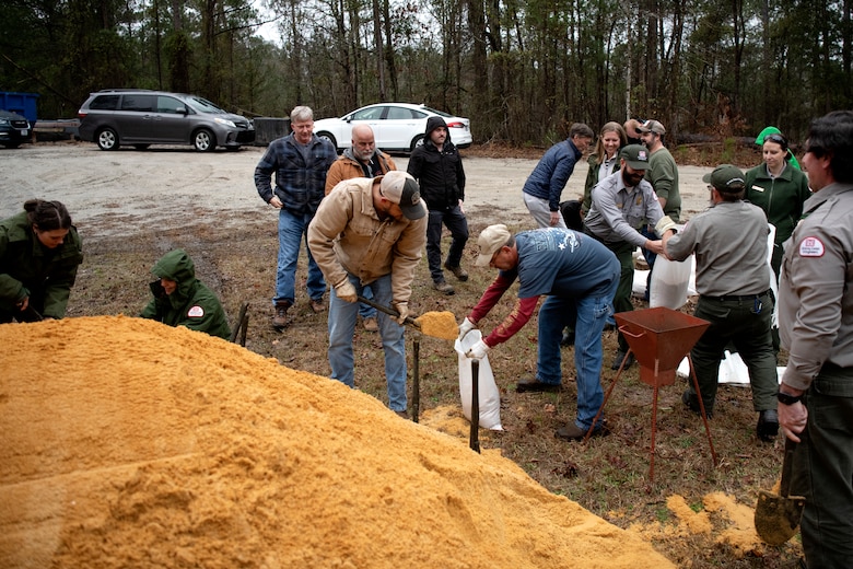 Mechanics, electricians, managers, specialists, and park rangers participate in a sandbag demonstration during dam safety training at the J. Strom Thurmond Project on Feb. 2, 2023. USACE photo by Mel Orr.