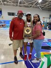 Kenneth Daniels is pictured with his daughter, Makayla, a senior guard for the University of Arkansas women’s basketball team, and wife, Wynetta, following a tournament in 2022. Daniels, a seasoned human resources professional and 21-year Army veteran, serves as interim director of the G-1 at U.S. Army Medical Logistics Command, drawing on past coaching with kids in sports growing up as he supports strong and cohesive teams at AMLC.
